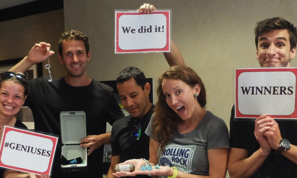 Work colleagues celebrating after escaping a room!